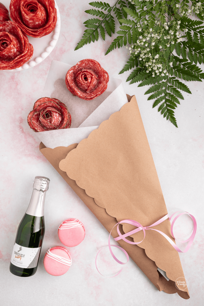 Place your salami roses first in the bouquet. 
