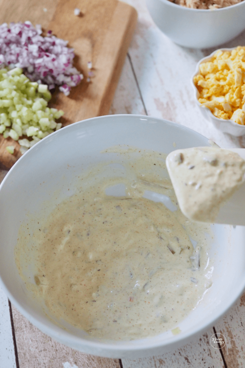 Mix tuna salad dressing well before adding other ingredients. 