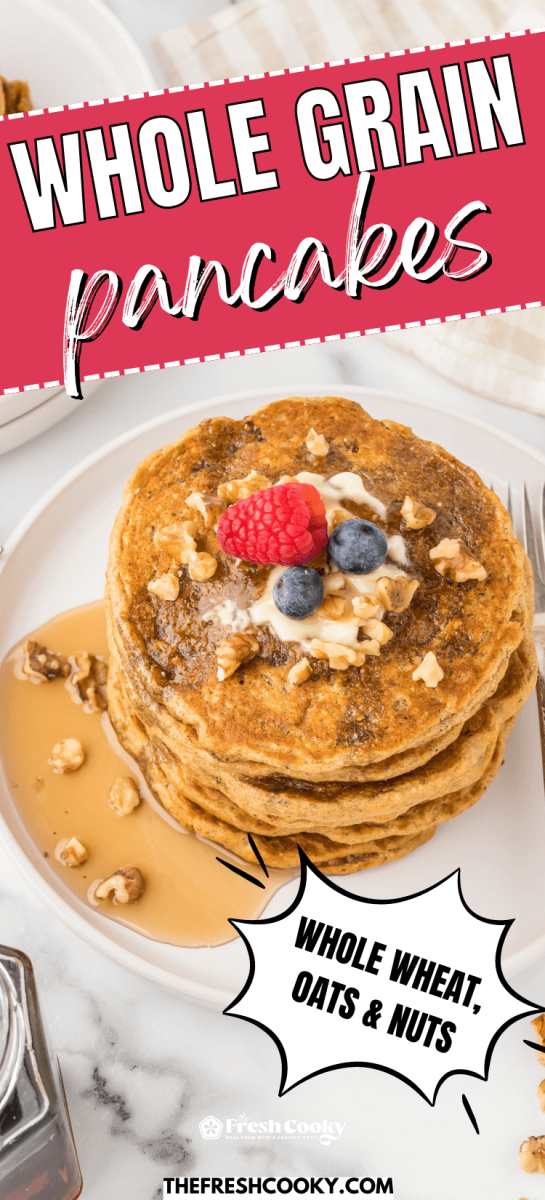 Whole grain pancakes stacked on plate topped with berries, butter, maple syrup and chopped walnuts, to pin.