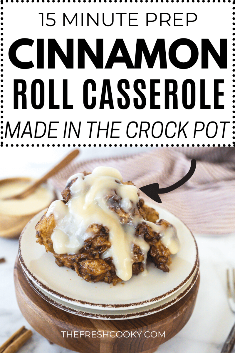 Plate with a serving of cinnamon roll casserole drizzled with cream cheese frosting, to pin.
