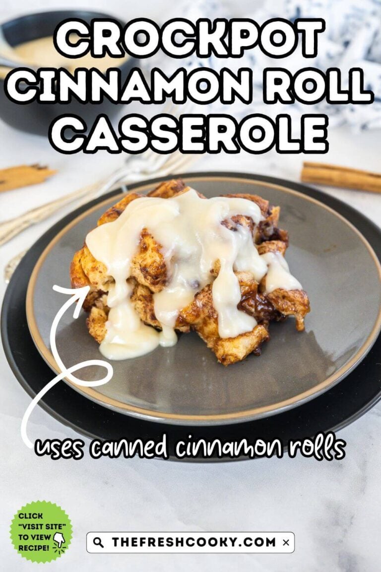 A serving of crock pot cinnamon roll casserole topped with cream cheese frosting, to pin.