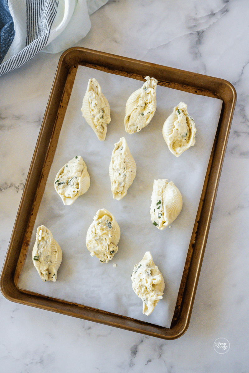 Frozen stuffed shells on quarter sheet pan. 