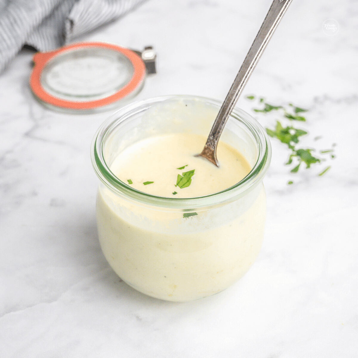 Easy alfredo sauce recipe in jar, for storage.