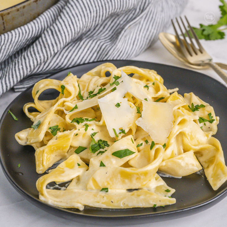 Alfredo sauce over fettuccine sprinkled with fresh shaved parmesan and parsley.