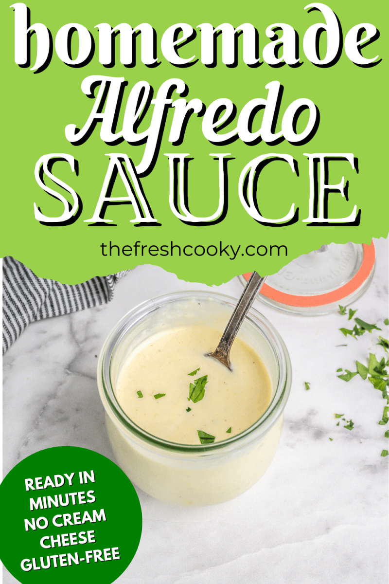 Jar of homemade alfredo sauce with spoon, to pin.