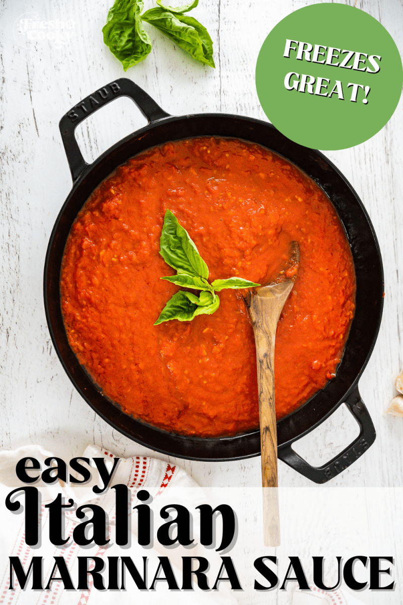 Skillet filled with rich, thick, Italian marinara sauce, topped with fresh basil - to pin.
