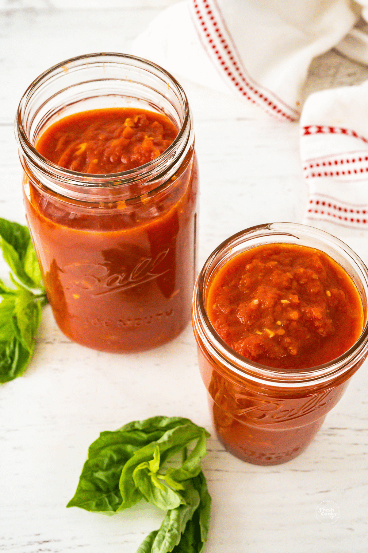 Italian Marinara sauce recipe in jars for storage.