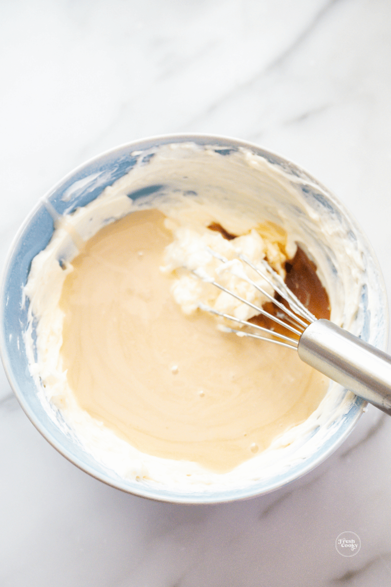 Whisk icing packets and butter and cream cheese mixture until smooth. 