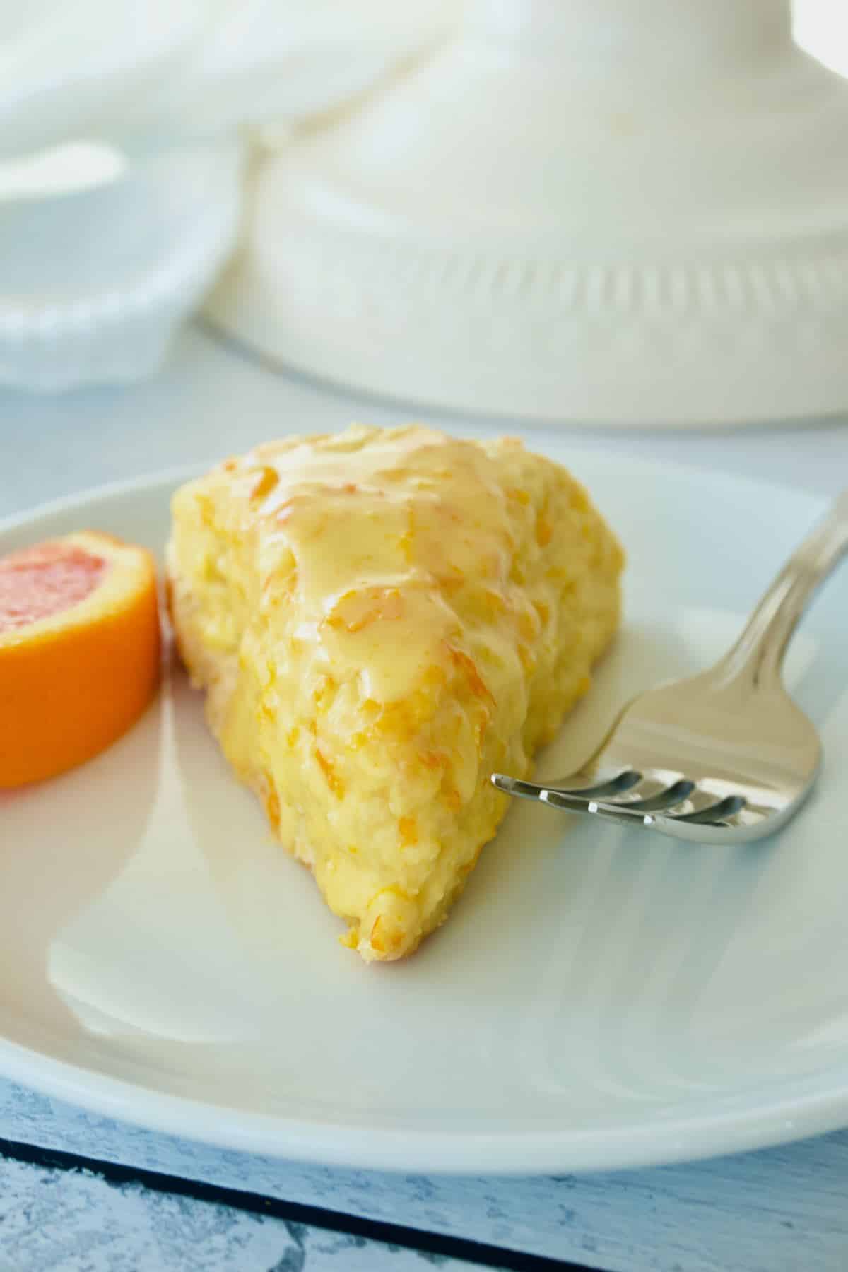 Panera Orange Scone with slice of orange.