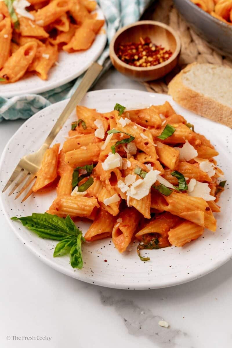 A plateful of penne alla vodka with fresh basil. 