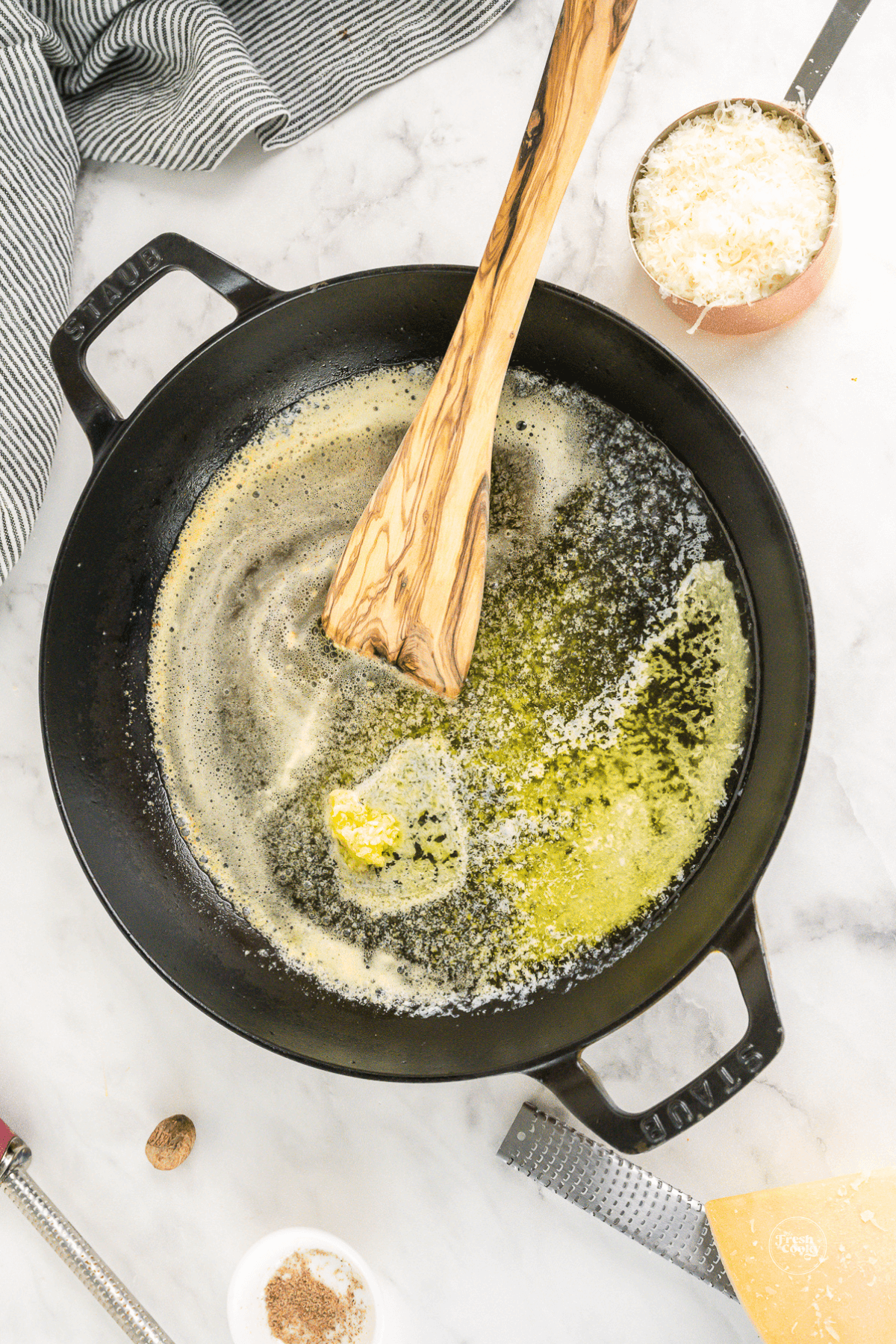 Melted butter in sauce pan with garlic to saute.