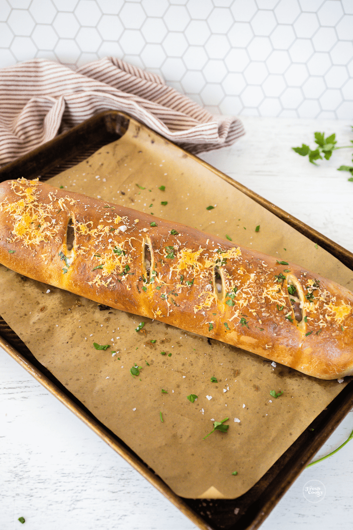 Stromboli baked on baking sheet.