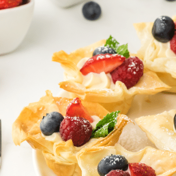 Phyllo Cheesecake Cups om a white plate.
