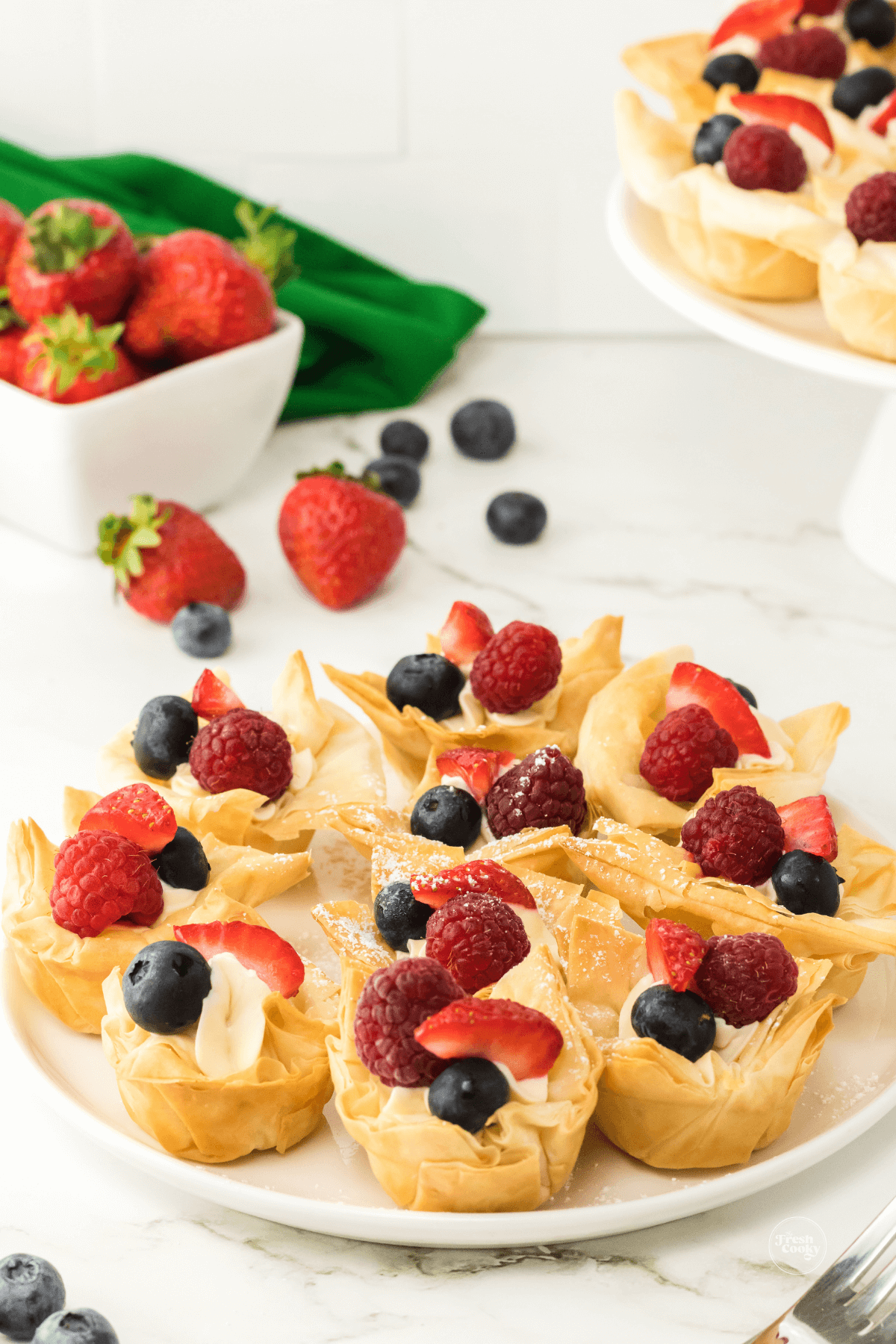 Strawberry Cheesecake Phyllo Cups on plate for serving.