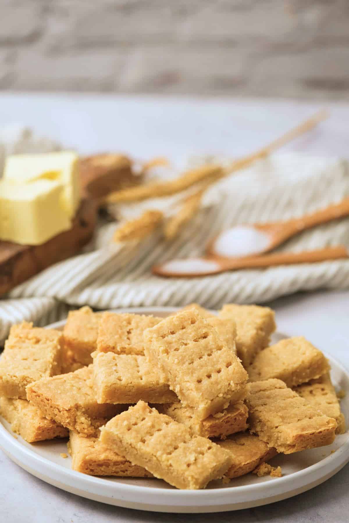 A plate filled with shortbread fingers, light and golden brown.