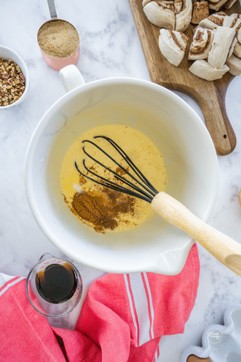 Whisking spices into egg mixture for cinnamon rolls. 