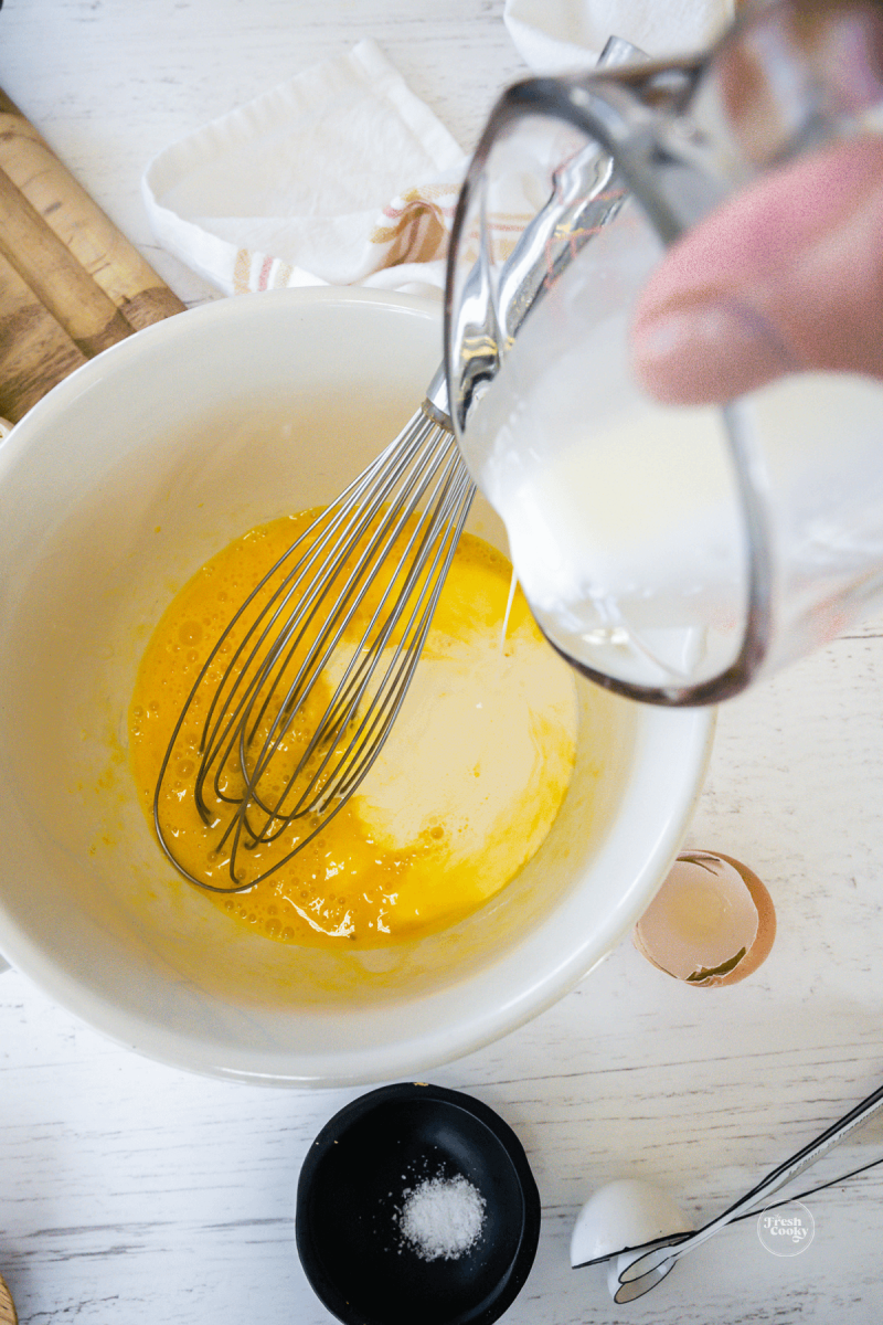Beat eggs, add cream for custard for cinnamon rolls.