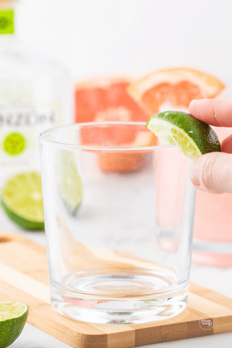 Wetting paloma glass rim for salt ring.
