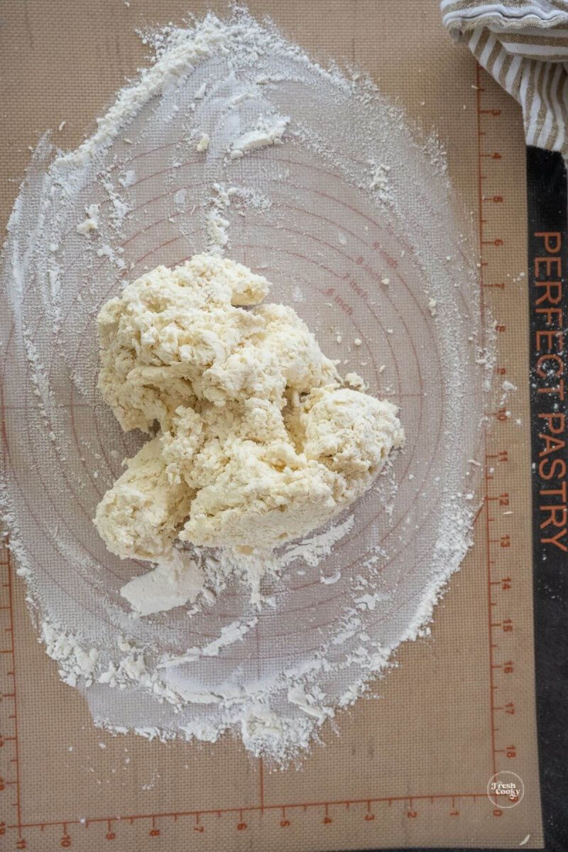 2 ingredient biscuit dough on floured mat. 