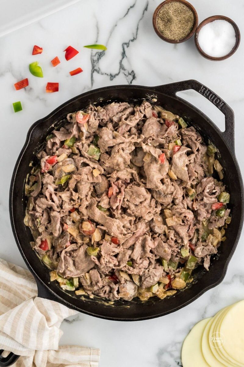 Shaved Steak and veggies mixed with other cheesesteak ingredients.