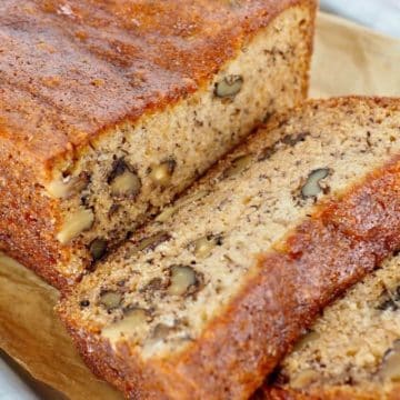 Best ever high altitude banana bread recipe sliced with walnuts in bread.