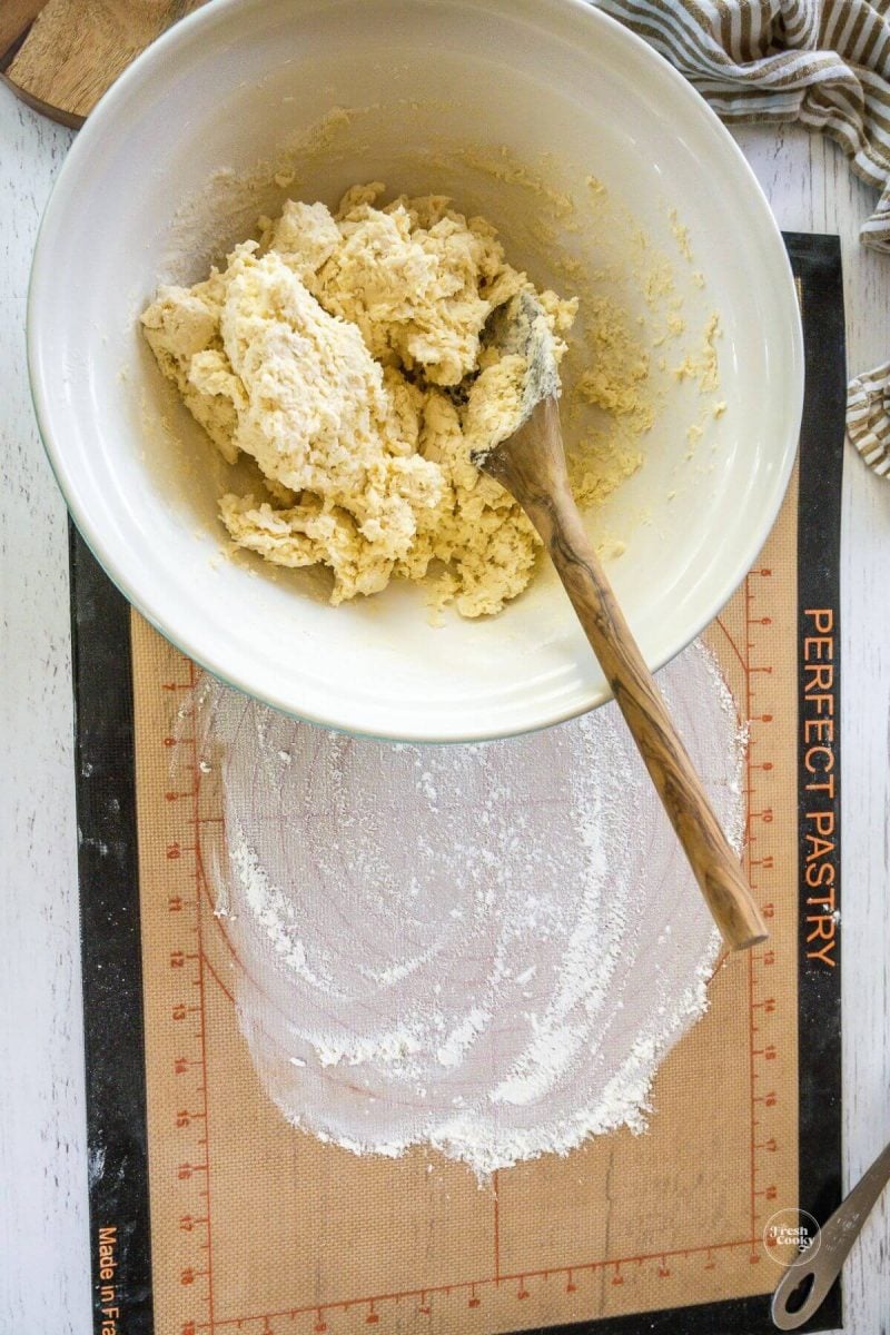 Mixed flour and cream in bowl. 