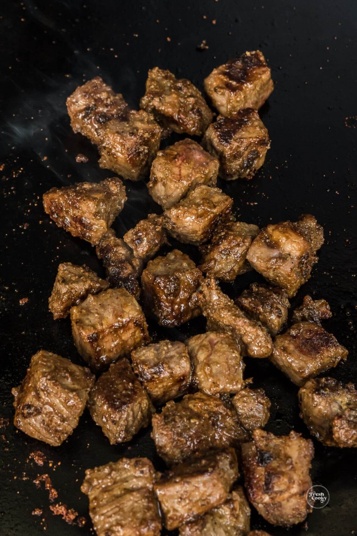 Steak searing on Blackstone grill for Hibachi steak.