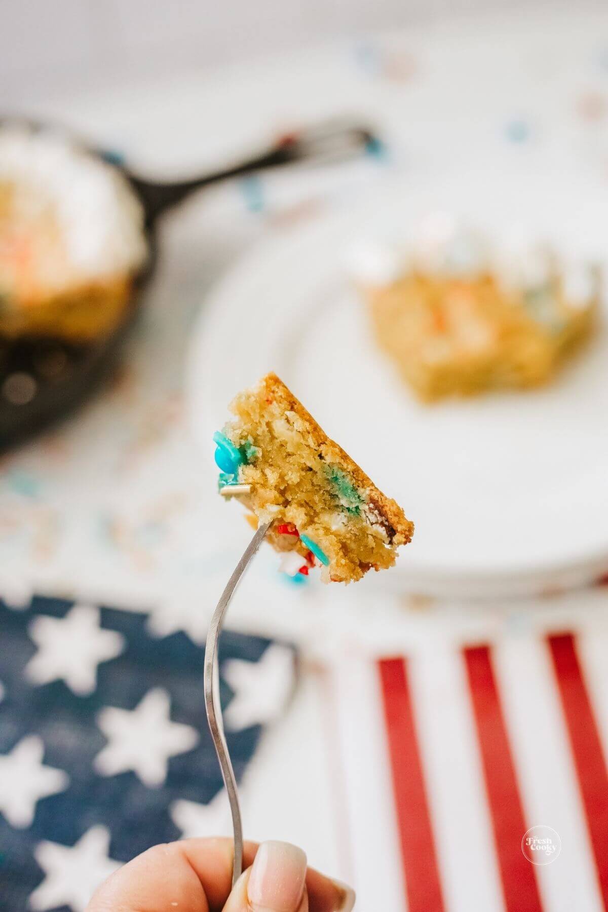 Moist bite of patriotic pizookie on a fork.