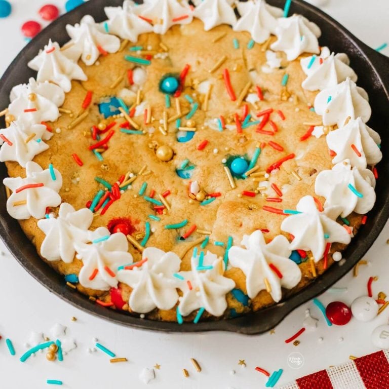 Patriotic 4th of July Cookie Cake in a skillet with frosting.