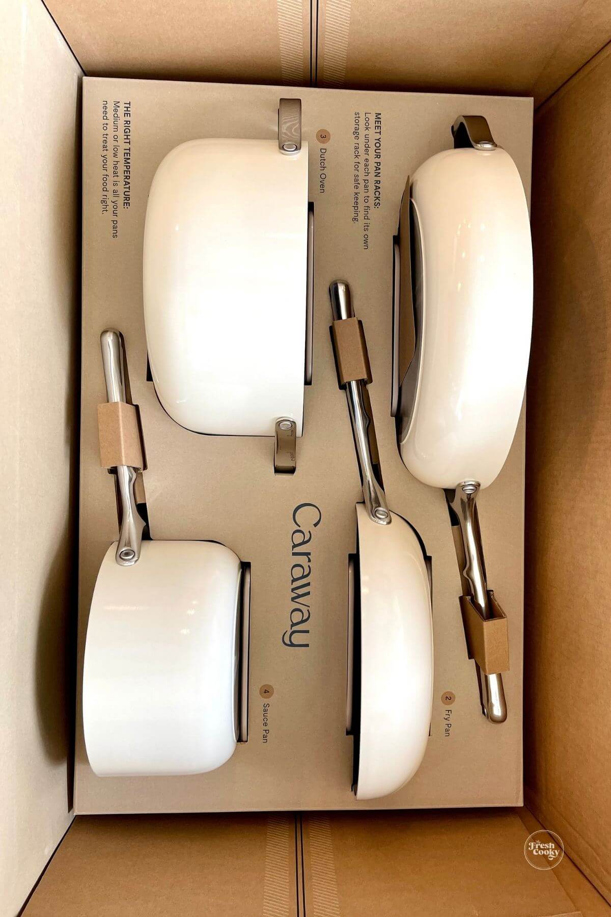 Caraway pots and pans in their box.