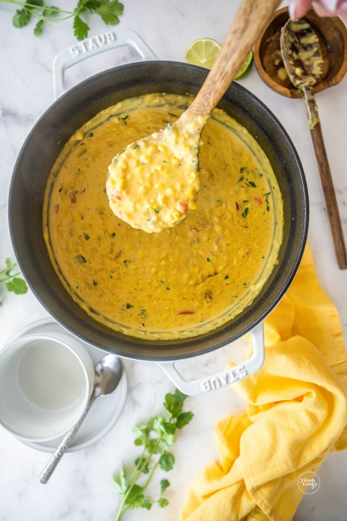 Spoonful of Panera Bread Corn Chowder recipe out of soup pot, to pin.