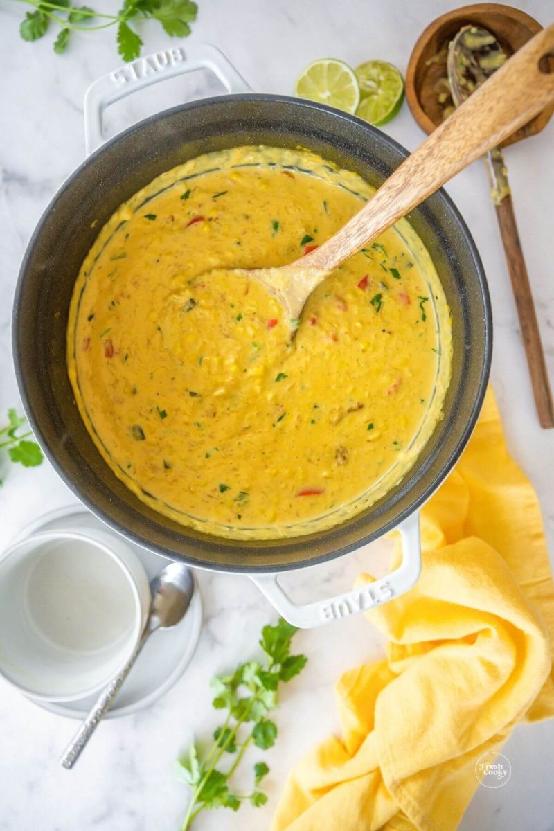 Give the corn chowder a good stir to combine flavors. 
