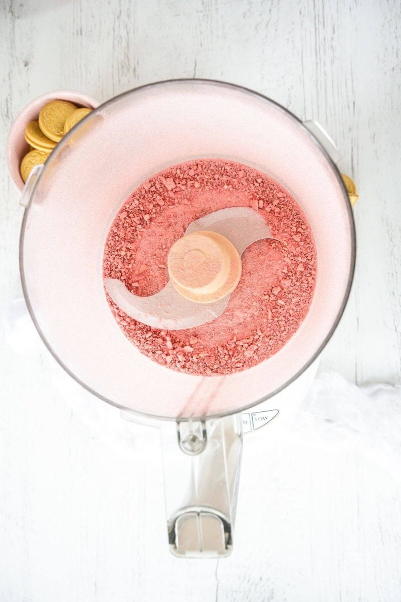 Strawberries pulsed into fine crumbs or powder in food processor.