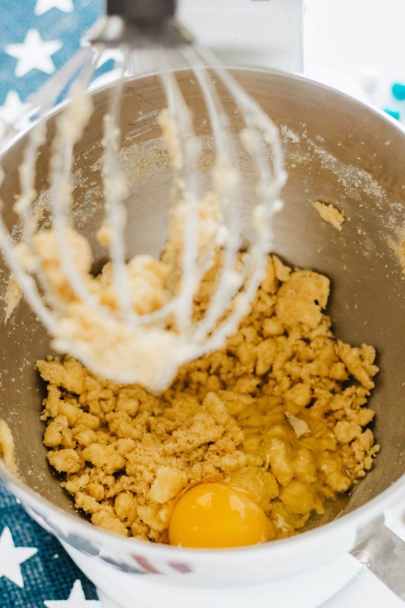 Mix in egg and vanilla to cookie batter. 