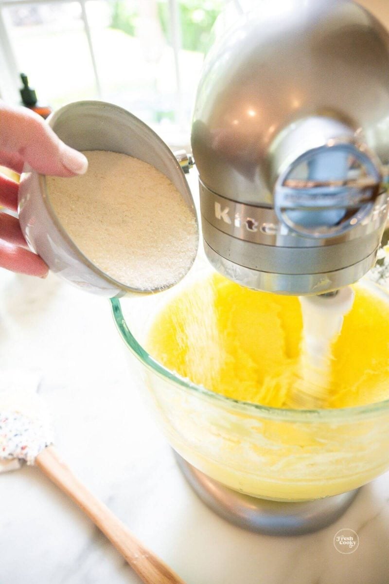 Creaming in sugar to whipped butter for strawberry bundt cake. 