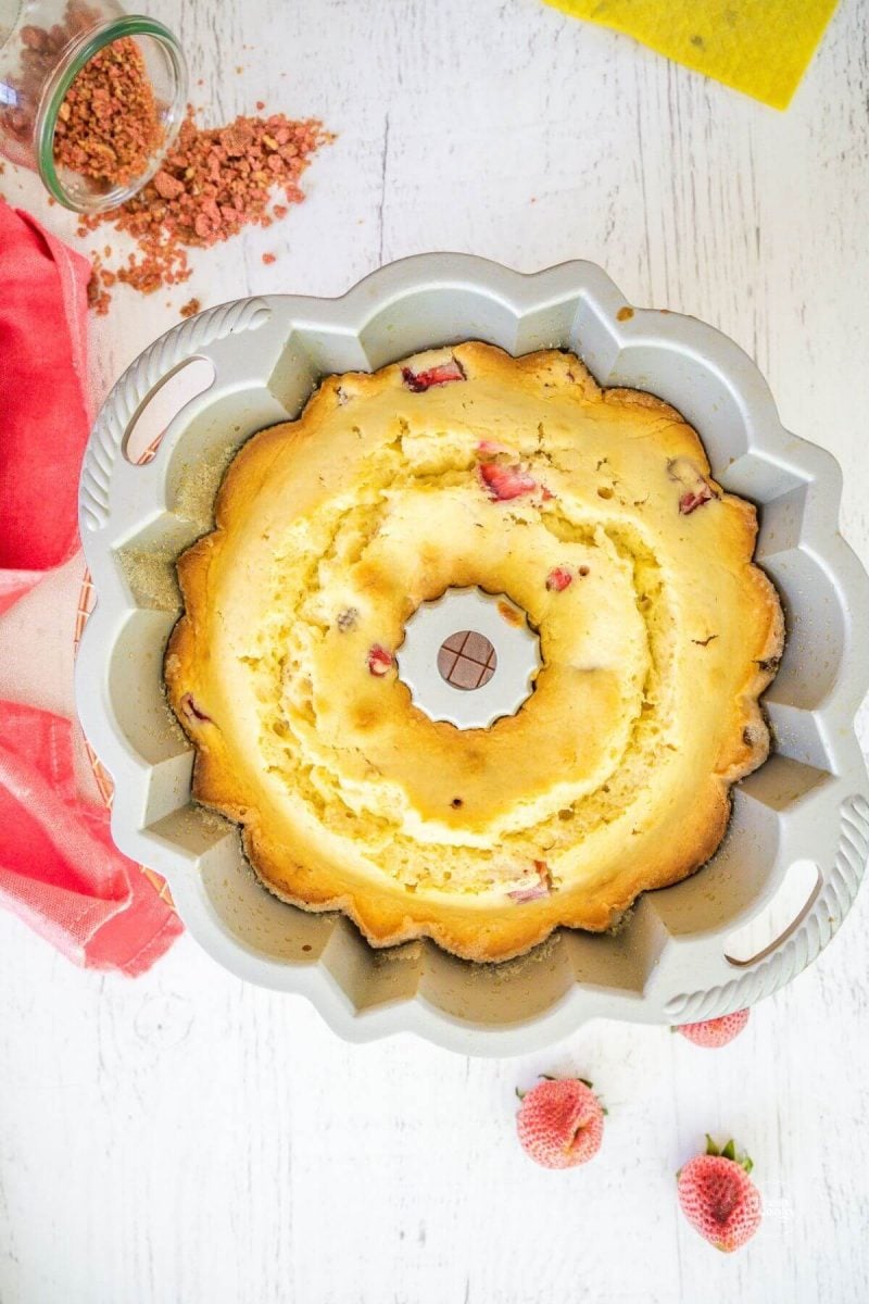 Baked strawberry bundt cake in bundt pan. 