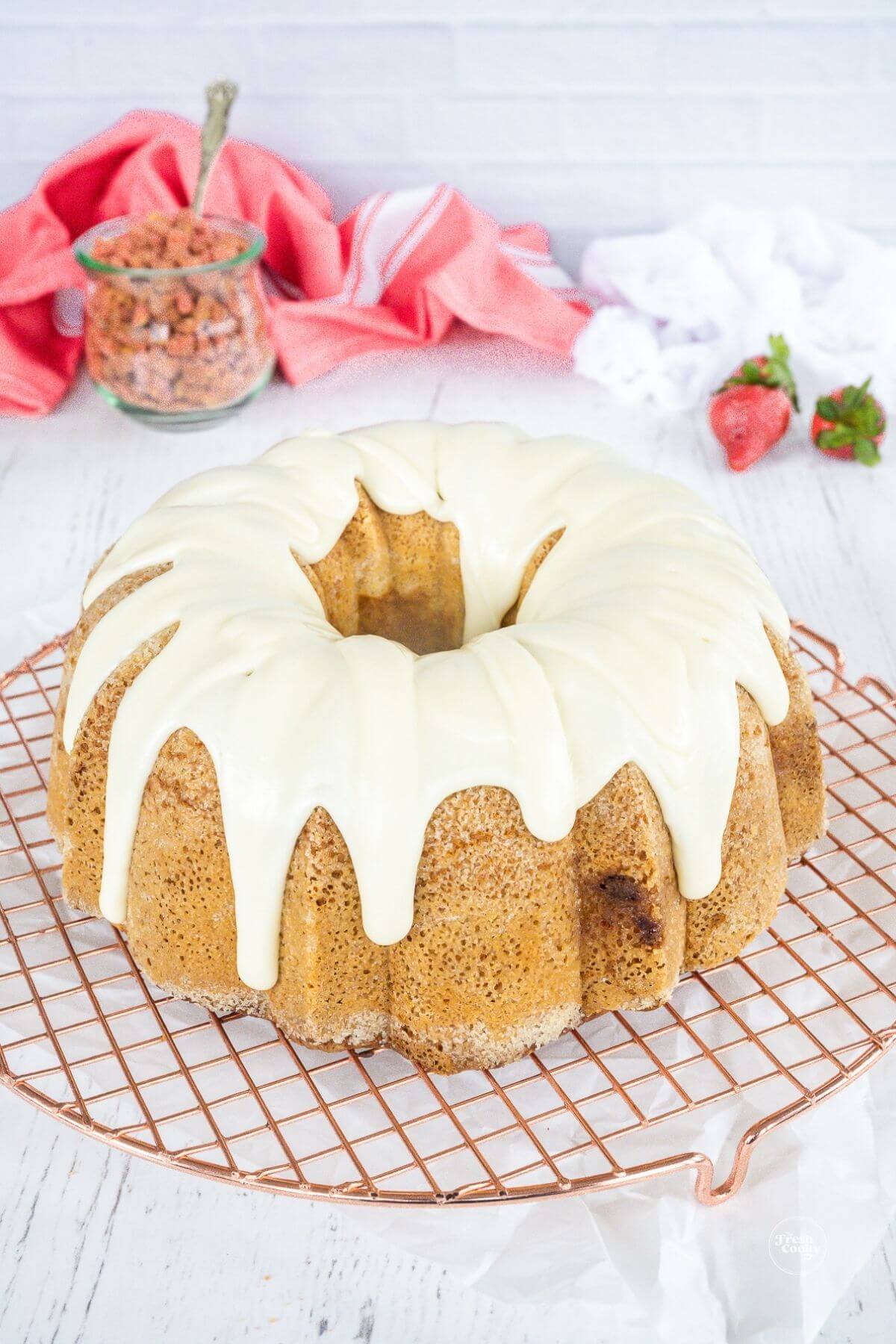 Strawberry crunch cake with glaze poured over the top.