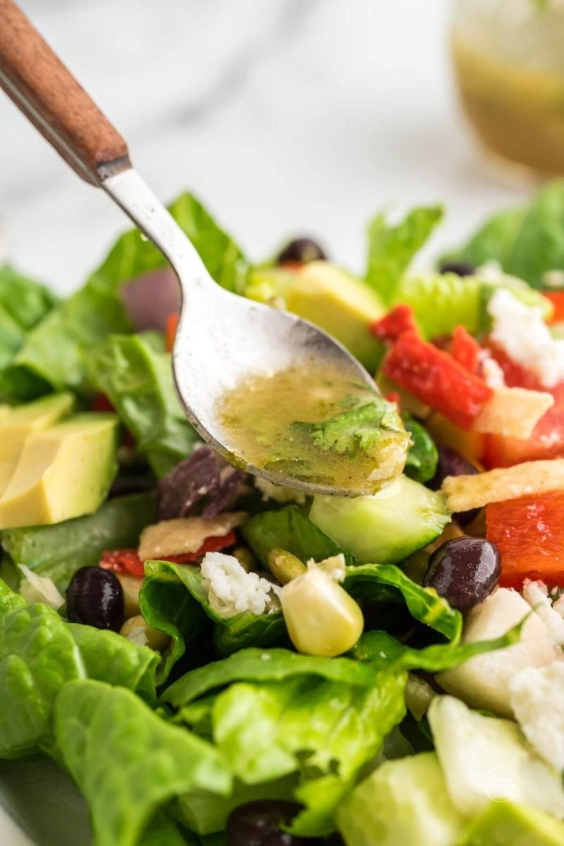 Drizzle the honey lime dressing over the top of the salad.