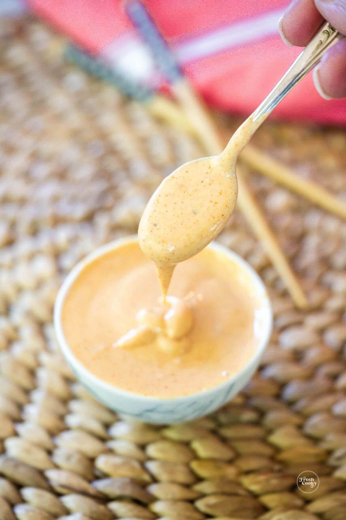 Silky hibachi sauce recipe also known as yum yum sauce in small bowl with spoon.