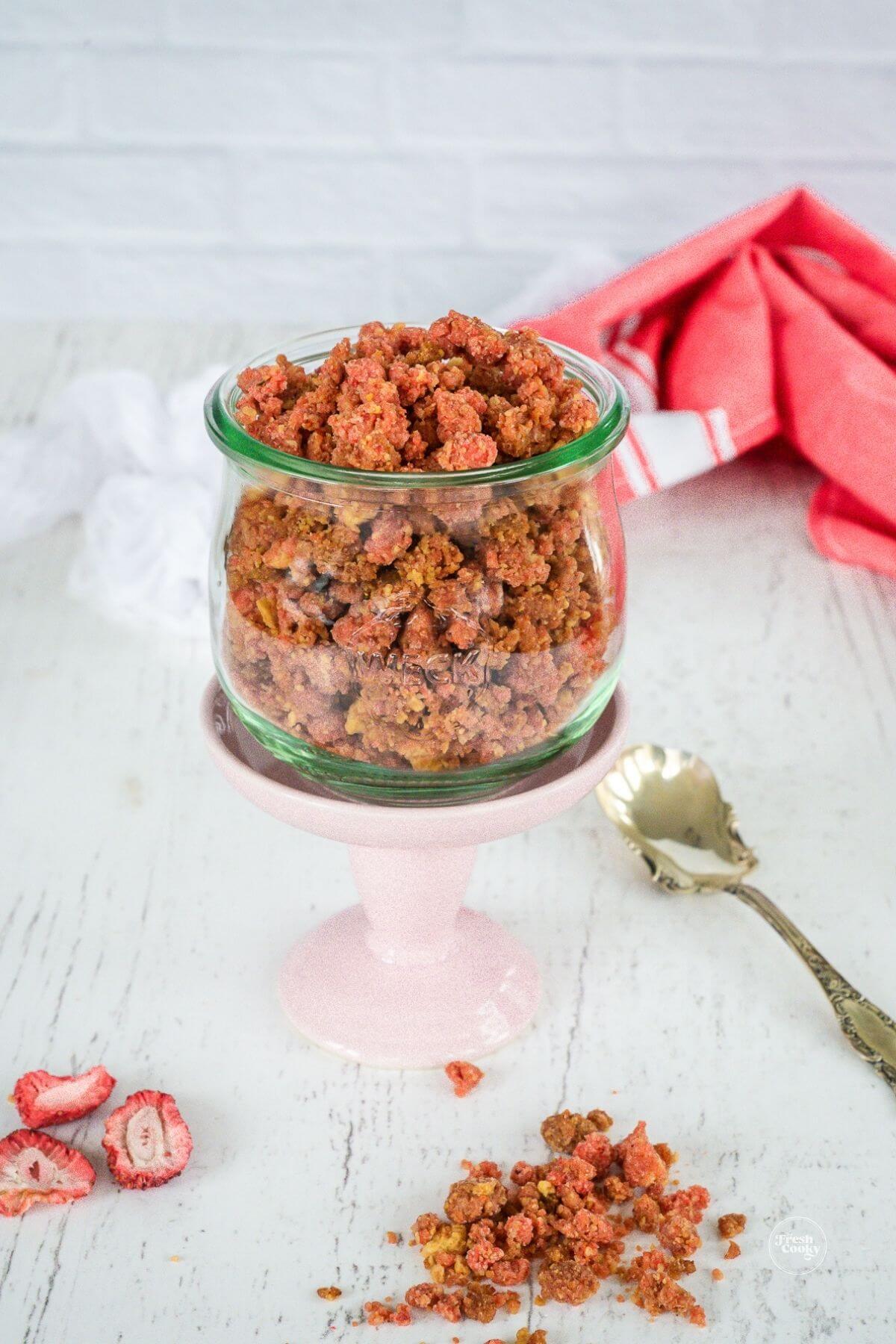 Strawberry Crunch crumble topping in jar.