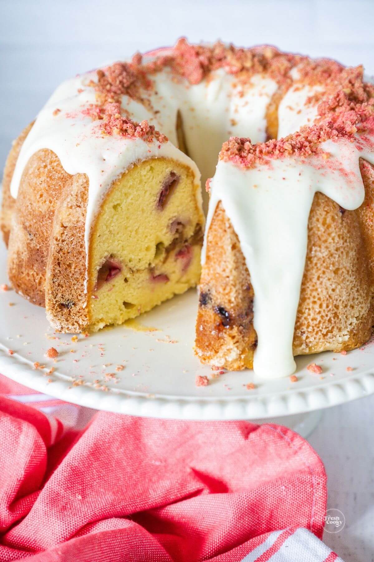 Strawberry crunch pound cake with slice removed.