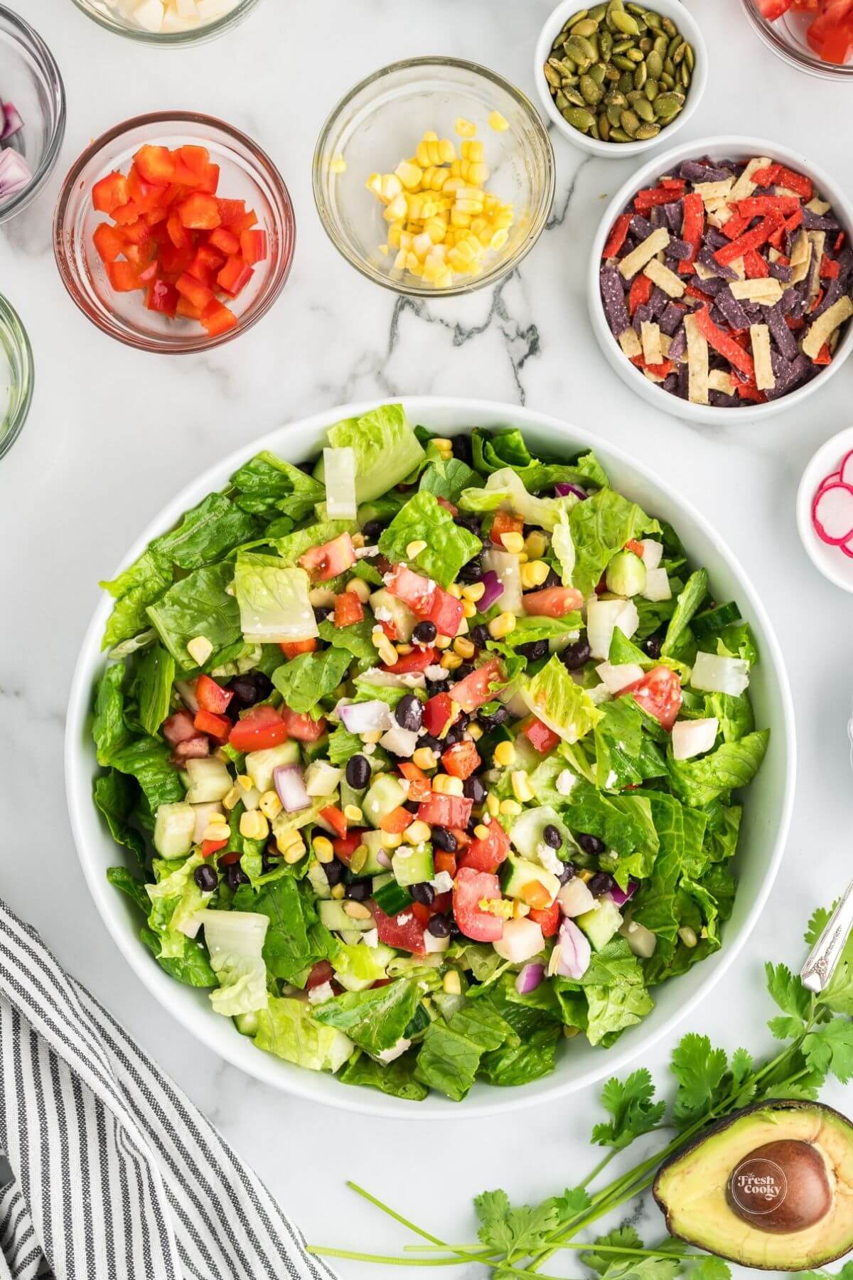 Tossed healthy Mexican chopped salad in large bowl.