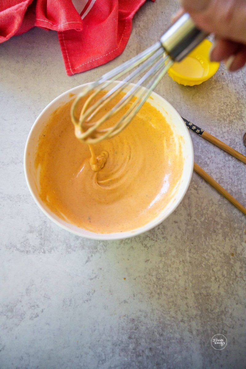 Smooth and pourable hibachi sauce with whisk.