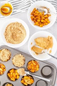 Spread cookie dough, apples and top with caramel and streusel topping.