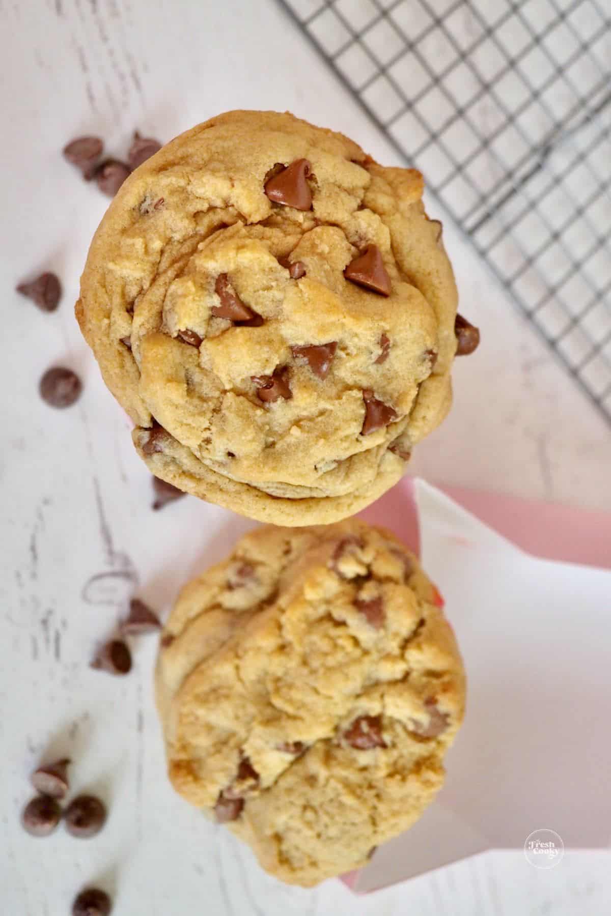 The Fresh Cooky copycat Crumbl chocolate chip cookie on top and bottom is bought crumbl chocolate chip cookie.