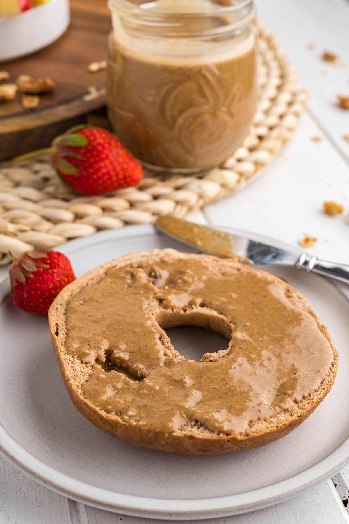 Spread granola butter onto toasted bagels.