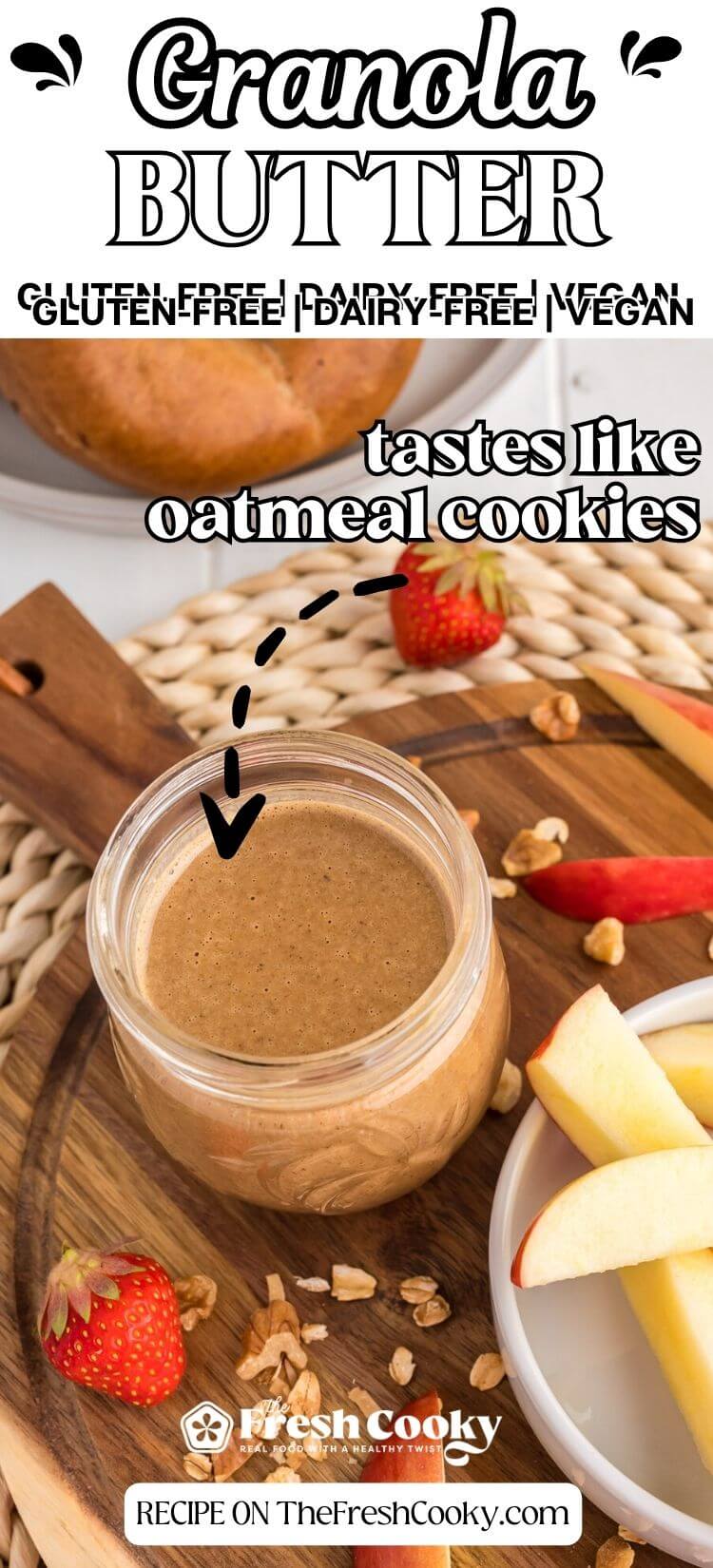 Granola butter in jar with apples nearby, to pin