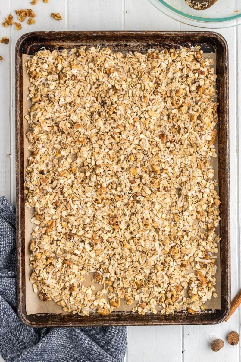 Granola on baking sheet ready for oven to bake. 