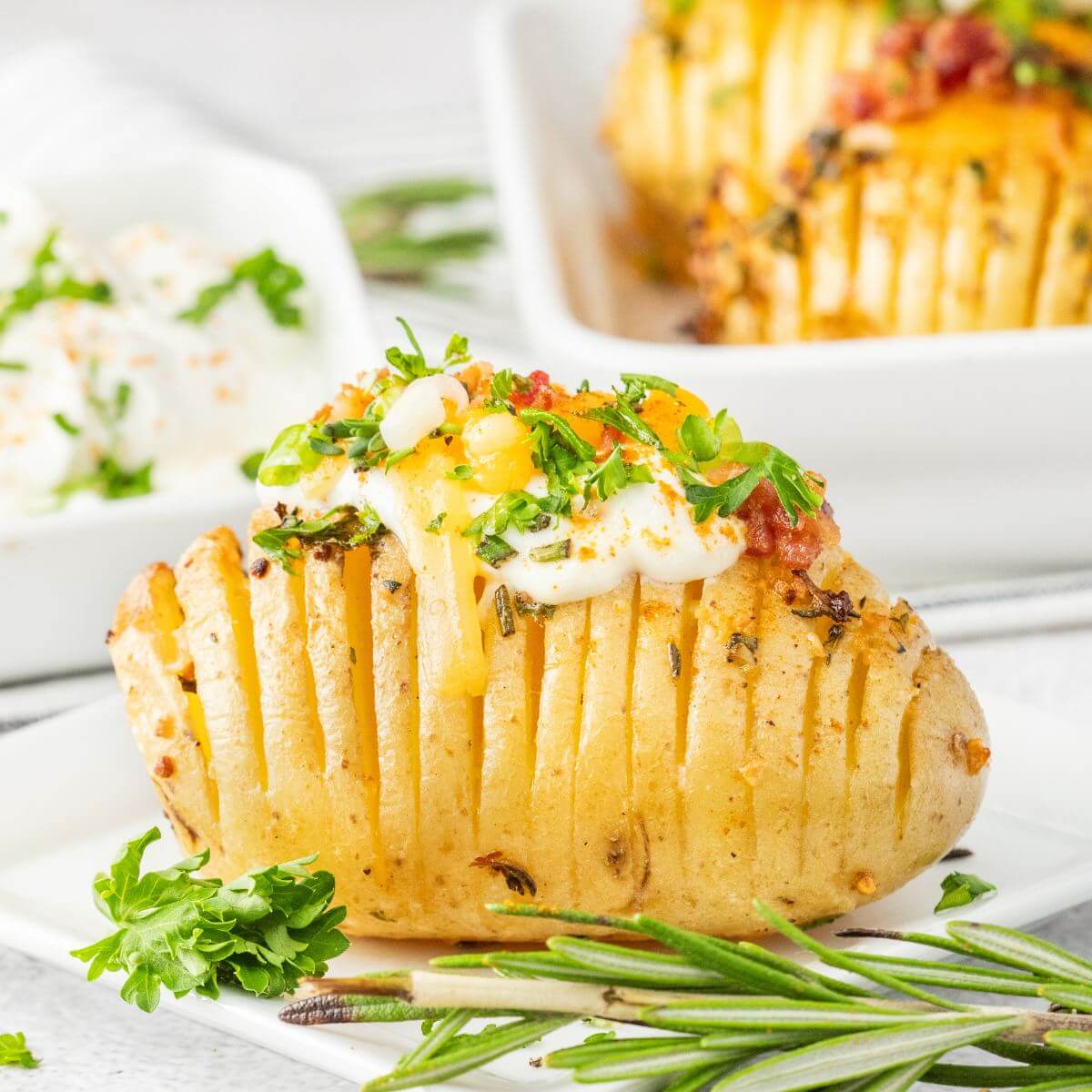 Air Fryer Hasselback potato with garlic herb butter.