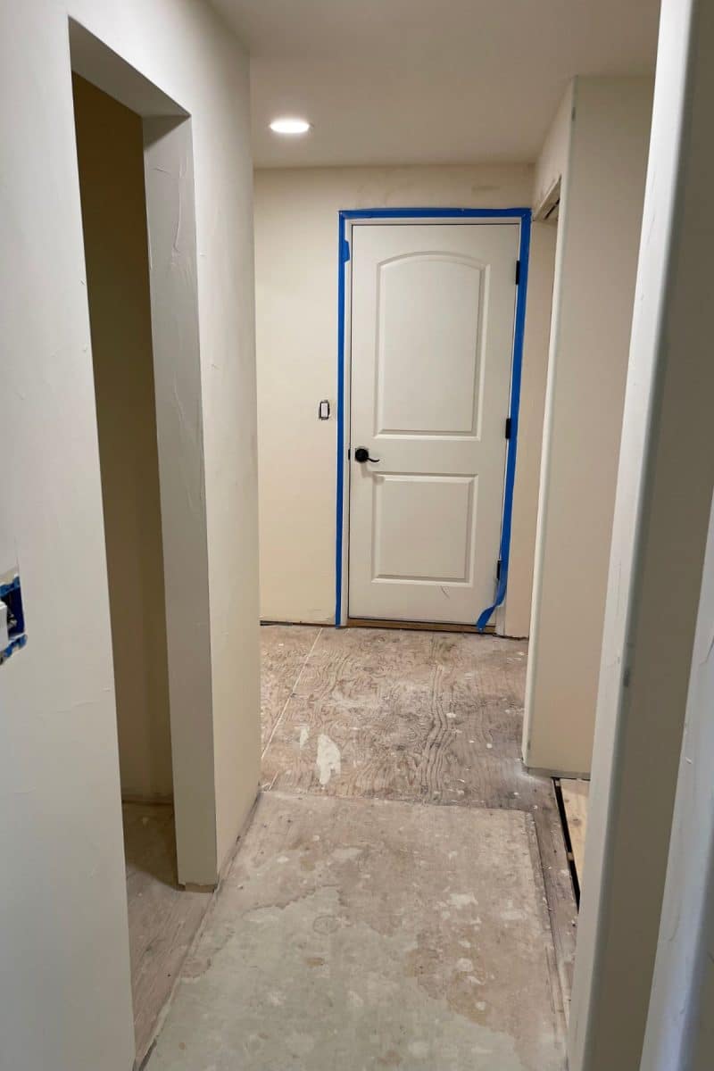 Hallway to mud room, pantry and laundry room, textured. 